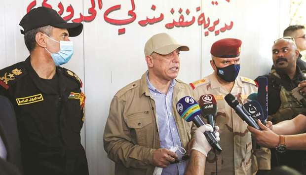 Iraqi Prime Minister Mustafa al-Kadhemi speaks to the media at Mandali border crossing between Iraq and Iran, yesterday.