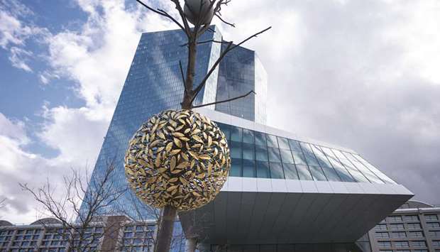 A bronze and granite tree-shaped sculpture entitled Gravity and Growth stands outside the main entrance of the European Central Bank headquarters in Frankfurt. More than half of respondents in a Bloomberg survey predict an increase in the ECBu2019s u20ac1.35tn pandemic purchase program ($1.5tn) by December, with most expecting an extension and a top-up of u20ac500bn.