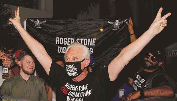 Roger Stone reacts after President Donald Trump commuted his federal prison sentence outside his home in Fort Lauderdale, Florida, on Friday night.