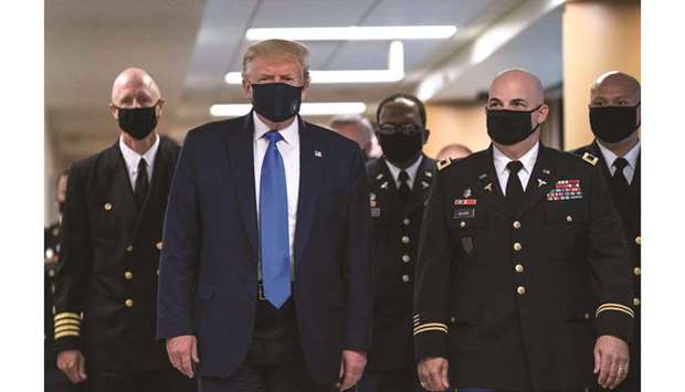 President Donald Trump wears a mask on a visit to Walter Reed National Military Medical Center in Bethesda on Saturday.