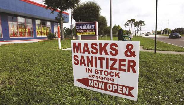 The Kash & Karry Supermarket gift shop located near the Walt Disney World theme park was selling masks and hand sanitisers for customers on Saturday in Lake Buena Vista, Florida.