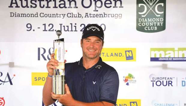Marc Warren poses with the trophy after winning the Austrian Open yesterday. (European Tour)