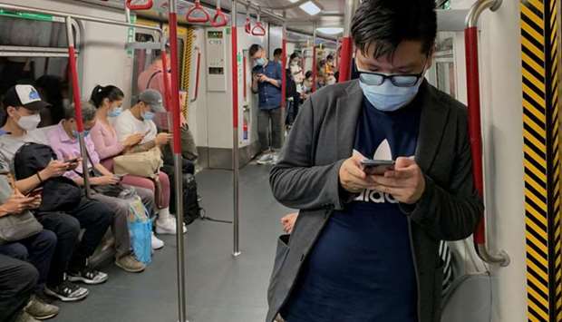 Passengers wear surgical masks in an MTR train, following the outbreak of the coronavirus in Hong Kong,