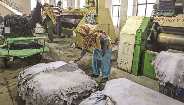 A worker handles a sheet of leather at the Jalandhar Leather (India) Pvt tannery in Punjab. Nearly 35% of the 650mn small businesses in India could shut down soon in the absence of government support, the Consortium of Indian Associations said in a letter to Prime Minister Narendra Modiu2019s office.