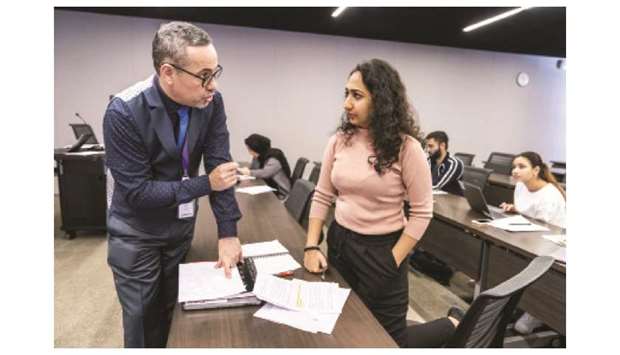 NU-Qu2019s Jairo Lugo-Ocando, director of executive and graduate education, with student Inaara Gangji.