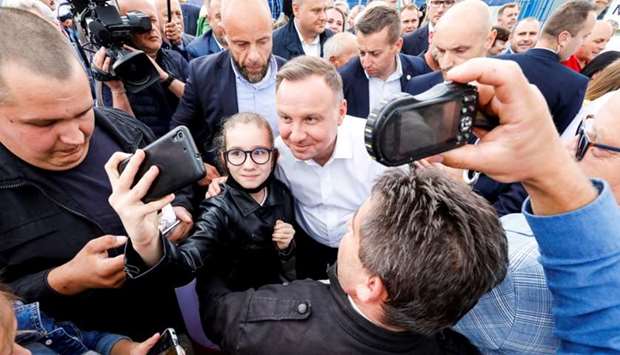 Polish President Andrzej Duda attends a meeting with local residents following his victory in a presidential election in Odrzywol, Poland