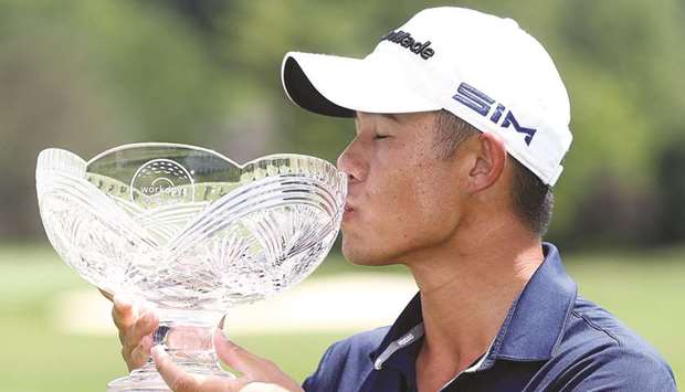 Collin Morikawa of the United States celebrates with the trophy after winning the Workday Charity Open at Muirfield Village Golf Club in Dublin, Ohio. (Getty Images/AFP)