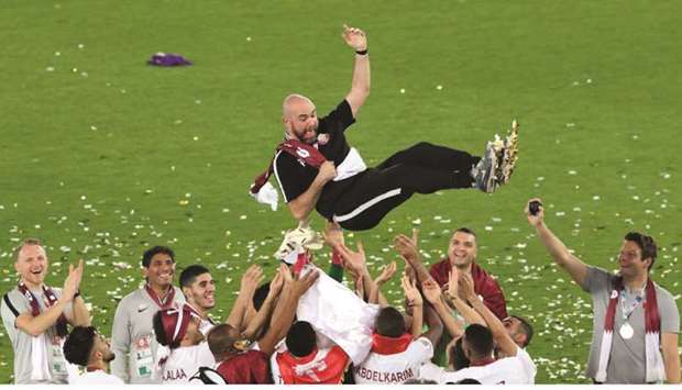 In this February 1, 2019, picture, Qatar coach Felix Sanchez celebrates winning the AFC Asian Cup with his players after the win over Japan in the final in Abu Dhabi. (Reuters)