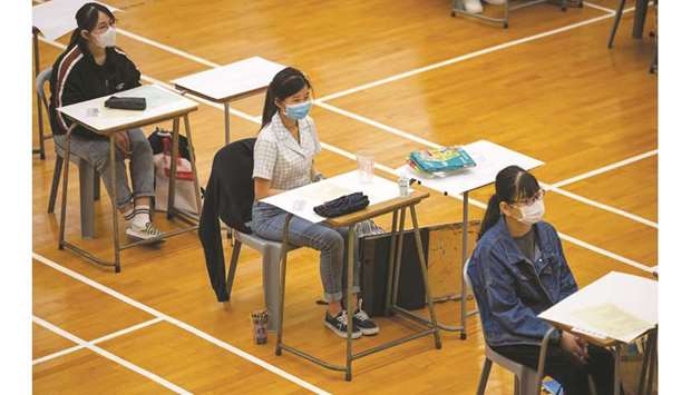 FILE PHOTO: Students attend to take the Diploma of Secondary Education (DSE) exams, following the coronavirus disease (Covid-19) outbreak, in Hong Kong, China, on 24 April.