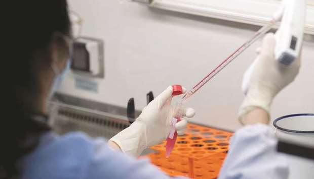 FILE PHOTO: A scientist works in the lab of Linqi Zhang on research into novel coronavirus disease (Covid-19) antibodies for possible use in a drug at Tsinghua Universityu2019s Research Center for Public Health in Beijing, China, on March 30.