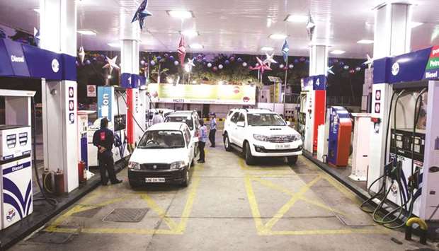 Customers refuel their vehicles at a Hindustan Petroleum Corp petrol station in New Delhi. Thereu2019s been a staggering fivefold increase in taxes on petrol since 2014 when Prime Minister Narendra Modi came to power, while those on gasoline have more than doubled. State governments also impose fuel levies, which in Delhi state account for around a quarter of the retail prices.