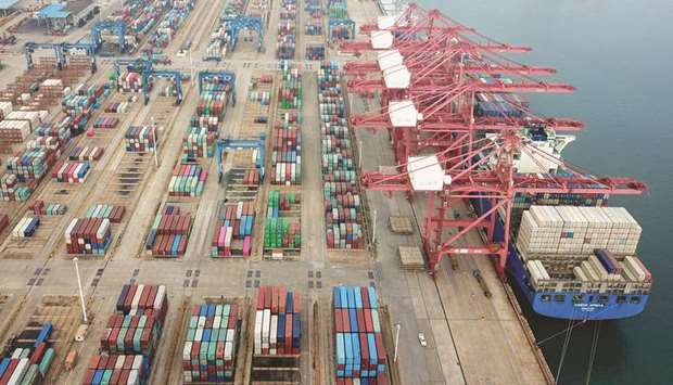 Containers stacked at a port in Lianyungang in Chinau2019s eastern Jiangsu province. Chinese trade enjoyed surprise growth in June as the world slowly emerges from economy-strangling lockdowns, though officials warned of headwinds for recovery owing to the spread of the pandemic.