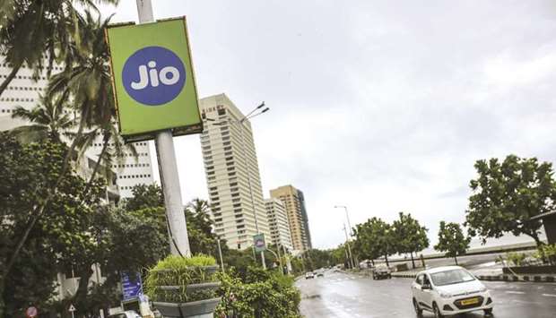 An advertisement for Jio Platforms, the mobile network of Reliance Industries, is displayed at Marine Drive in Mumbai. Google is in advanced talks to buy a $4.5bn stake in Jio, the digital arm of Indian billionaire Mukesh Ambaniu2019s conglomerate, people familiar with the matter said, seeking to join rival Facebook Inc in chasing growth in a promising internet and e-commerce market.