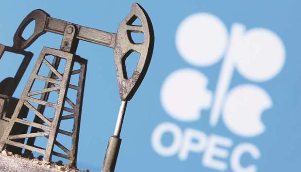 A 3D printed oil pump jack is seen in front of the displayed Opec logo in this illustration picture (file). A key Opec+ ministerial panel agreed yesterday on moving to the next phase of a pact on oil output cuts by easing reductions from August, a source said.