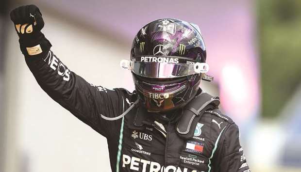 Mercedesu2019 British driver Lewis Hamilton celebrates winning the Formula One Styrian Grand Prix race on July 12, 2020 in Spielberg, Austria. (AFP)