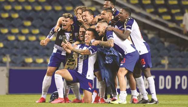 FC Porto players celebrate after winning the Portuguese Primeira Liga title. (AFP)