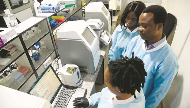 African Centre of Excellence for Genomics of Infectious Diseases (ACEGID) molecular biologists analyse Covid-19 samples in the laboratory located at the Redeemeru2019s University in Ede, southwestern Nigeria, on June 2.