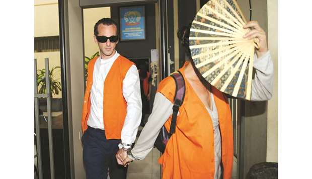 A file photo shows British national David Taylor with Australian national Sara Connor as they are transferred from Kerobokan prison ahead of their court appearance in Denpasar on Indonesiau2019s resort island of Bali.