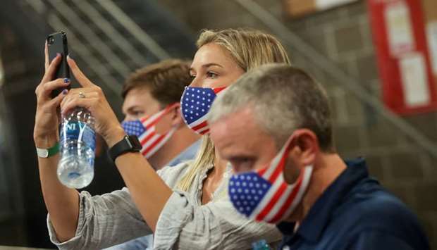 Attendees wear protective face masks as President Donald Trump speaks at an event on infrastructure at the United Parcel Service (UPS) Airport Facility in Atlanta, Georgia on July 15.