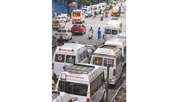 Ambulances to be used for Covid-19 emergencies are parked on a road after the city went into a new week-long lockdown from July 14 as number of coronavirus cases surged, in Bengaluru yesterday.