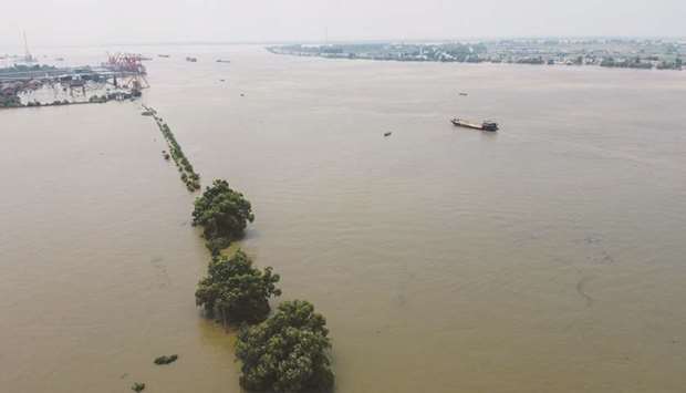An aerial view shows the swollen Yangtze river in Jiujiang, in Chinau2019s central Jiangxi province yesterday.