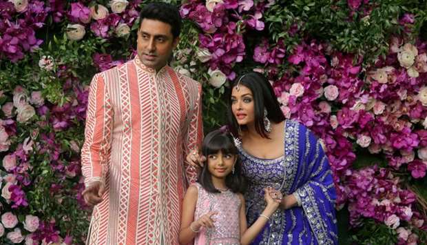 Actor Abhishek Bachchan, his wife actress Aishwarya Rai and their daughter Aaradhya pose during a photo opportunity at the wedding ceremony of Akash Ambani, son of the Chairman of Reliance Industries Mukesh Ambani, at Bandra-Kurla Complex in Mumbai, India