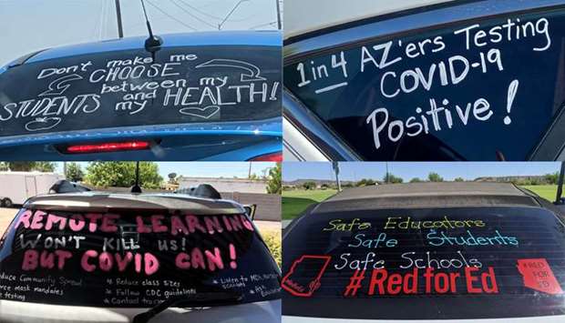 Slogans seen on cars in u2018a motor marchu2019 protest of teachers who took it to their vehicles to demand a delay in in-person learning in the fall, due to the coronavirus disease (COVID-19) outbreak, in Phoenix, Arizona