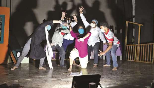 Actors wearing protective masks perform as they rehearse for This Valley of Death is Not My Country play at the Bidhan Auditorium, after authorities eased lockdown restrictions in Kolkata yesterday.
