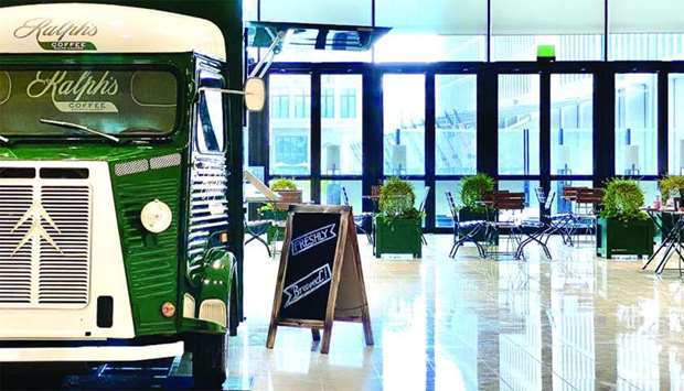 Ralphu2019s Coffee truck, a hunter green 1965 Citroen, will first be parked inside the atrium lobby of M7, QMu2019s new hub for innovation and entrepreneurship in fashion, design and technology, located in Msheireb Downtown Doha.