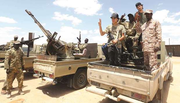Fighters loyal to the UN-recognised Libyan Government of National Accord (GNA) secure the area of Abu Qurain, halfway between the capital Tripoli and the second city Benghazi, against rebel forces, who are based in eastern Benghazi, yesterday.