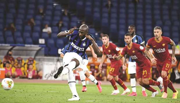 Inter Milanu2019s Romelu Lukaku scores their second goal from the penalty spot during the Serie A match against AS Roma at Stadio Olimpico in Rome, Italy, on Sunday. (Reuters)
