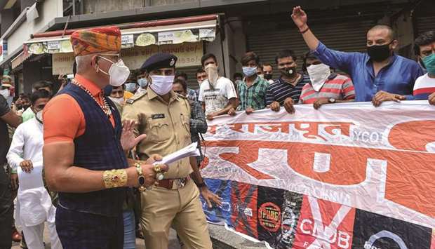 The chief of Gujarat Rashtriya Rajput Karni Sena organisation, Raj Shekhawat (in turban), gestures as he arrives to participate in a protest against vendors selling Chinese products at a market in Ahmedabad yesterday.