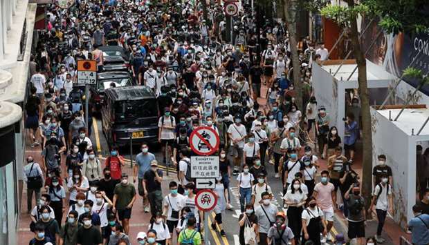 Anti-national security law protesters march at the anniversary of Hong Kongu2019s handover to China from Britain, in Hong Kong yesterday.