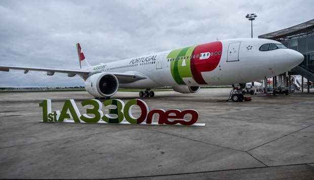 The TAP livery adorns an Airbus A330neo passenger aircraft when the Portugal airline took delivery of the first A330neo in Toulouse, France, on November 26, 2018. Like a string of other airlines, TAP asked for help in April after a collapse demand for travel in the coronavirus pandemic forced it to suspend almost all of its nearly 2,500 weekly flights.