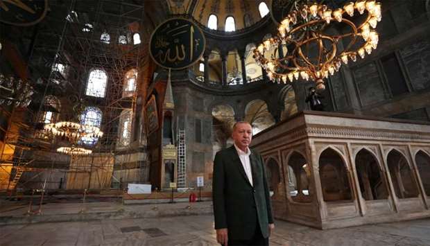 A file photo of President Tayyip Erdogan visiting the Hagia Sophia, called the Ayasofya-i Kebir Camii in Turkish, in Istanbul