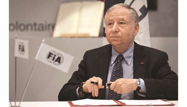 International Automobile Federation (FIA) President Jean Todt attends a signing ceremony in Geneva after the FIA delivered over two million euros to the IFRC to support the humanitarian organisationu2019s global fight against Covid-19 response. (AFP)