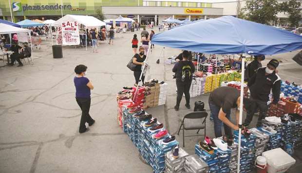 Shopkeepers sell their merchandise at the parking lot of a shopping plaza, where they are temporarily located, as the government has not announced a reopening date for shopping centres, during the coronavirus  outbreak, in Ciudad Juarez, Mexico.