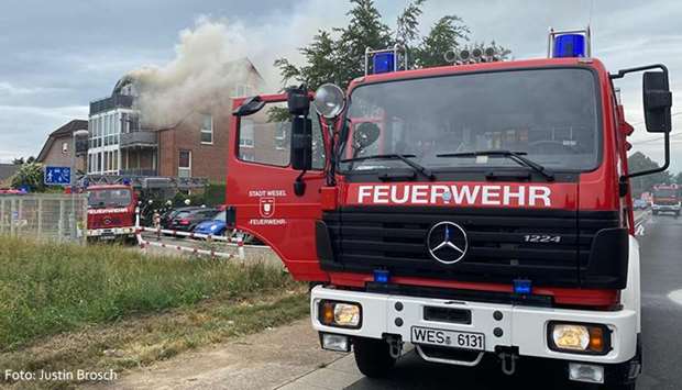 A picture being shared on social media shows a firefighting vehicle at the scene of crash as smoke emanates from the building into which the microlight plane crashed