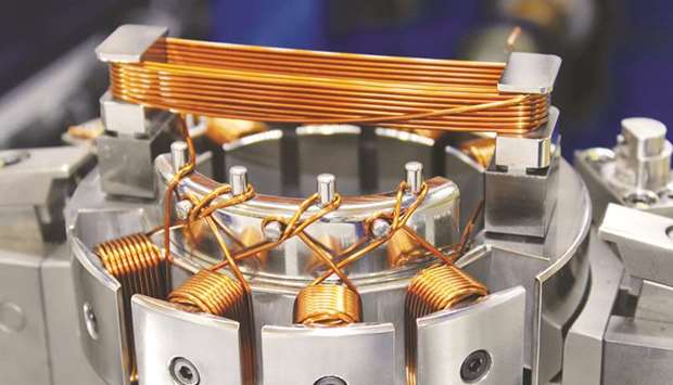 A sample coil winding machine, which winds copper wires in three different ways. The global market for coil-winding machines is projected to expand at 10% annually and will reach $1.3bn in 2024, according to Global Info Research. Toyota and Tesla have become major cutomers of coil winding machines.