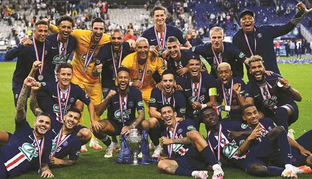 Paris Saint-Germainu2019s players celebrate with the trophy after winning the French Cup final against Saint-Etienne at Stade de France in Saint-Denis, outside Paris on Friday. (AFP)