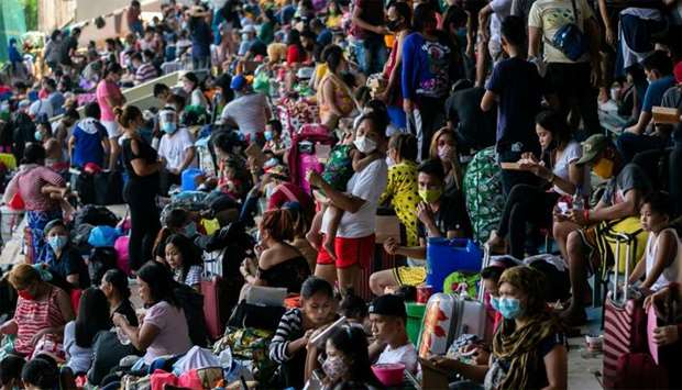 Filipinos stranded due to the coronavirus disease (COVID-19) restrictions are crammed inside a baseball stadium while waiting to be transported back to their provinces through a government transportation program, in Rizal Memorial Sports Complex, Manila, Philippines