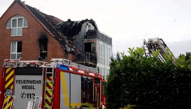 General view of the scene where an ultra-light aircraft has crashed into a residential building in Wesel, Germany