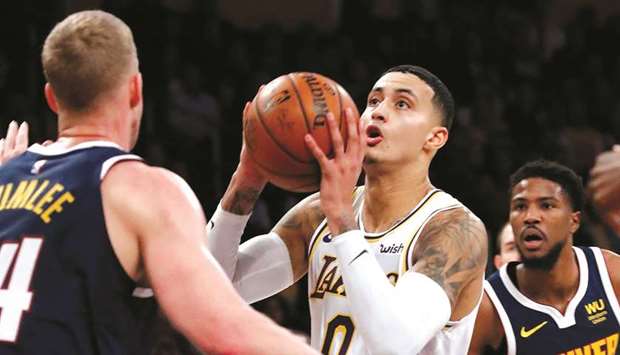 In this file photo taken on December 22, 2019, the Los Angeles Lakersu2019 Kyle Kuzma (centre) goes to the basket against the Denver Nuggets at Staples Center in Los Angeles. (TNS)