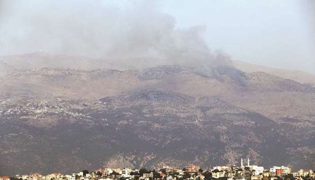 Smoke billows above the hills of Kfarchouba in the Shebaa Farms sector after reports of clashes in the Lebanese-Israeli border area, yesterday.
