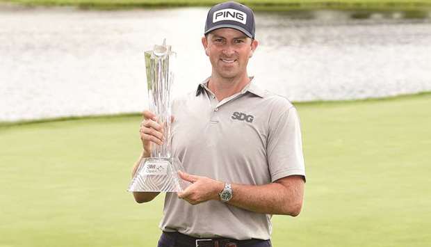 Michael Thompson of the United States poses with the trophy after winning the 3M Open at TPC Twin Cities in Blaine, Minnesota. (Getty Images/AFP)