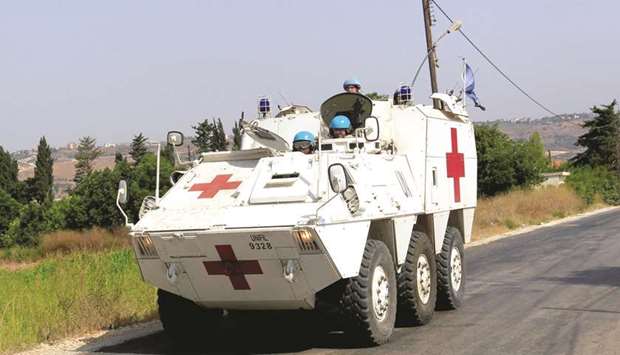 UN peacekeepers (UNIFIL) patrol the border with Israel, in the southern Lebanese village of Khiam, yesterday.