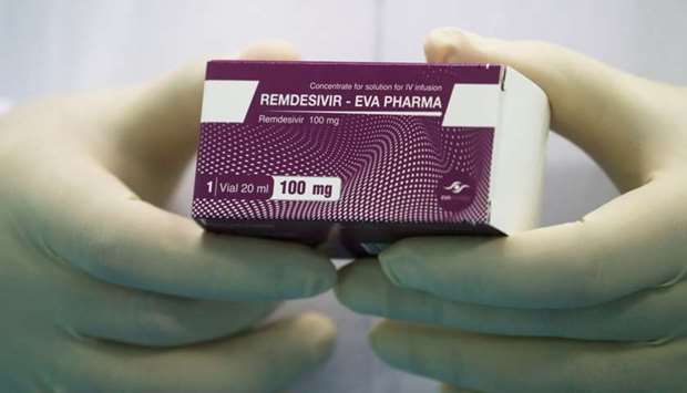 A lab technicians holds the coronavirus disease treatment drug ,Remdesivir, at Eva Pharma Facility in Cairo, Egypt