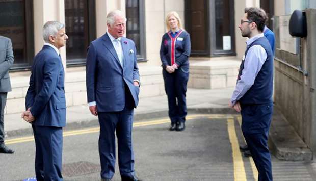 Prince Charles and mayor of London Sadiq Khan meet key workers from Transport for London, who have worked throughout the coronavirus outbreak, in London yesterday.