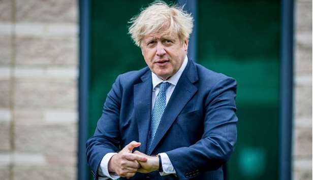 British Prime Minster Boris Johnson applies hand sanitiser during a visit to North Yorkshire Police to meet with recently graduated police officers in Northallerton, Britain, July 30.