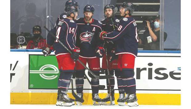 Boone Jenner of the Columbus Blue Jackets celebrates with teammates after scoring against Boston Bruins in their exhibition game at Scotiabank Arena in Toronto. PICTURE: USA TODAY Sports